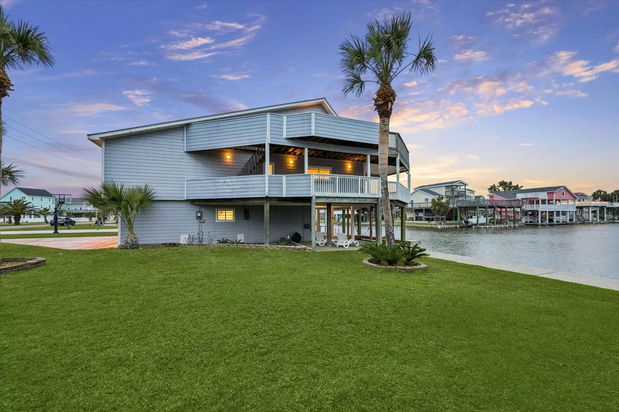 Image 1: Charming waterfront home with spacious balconies a