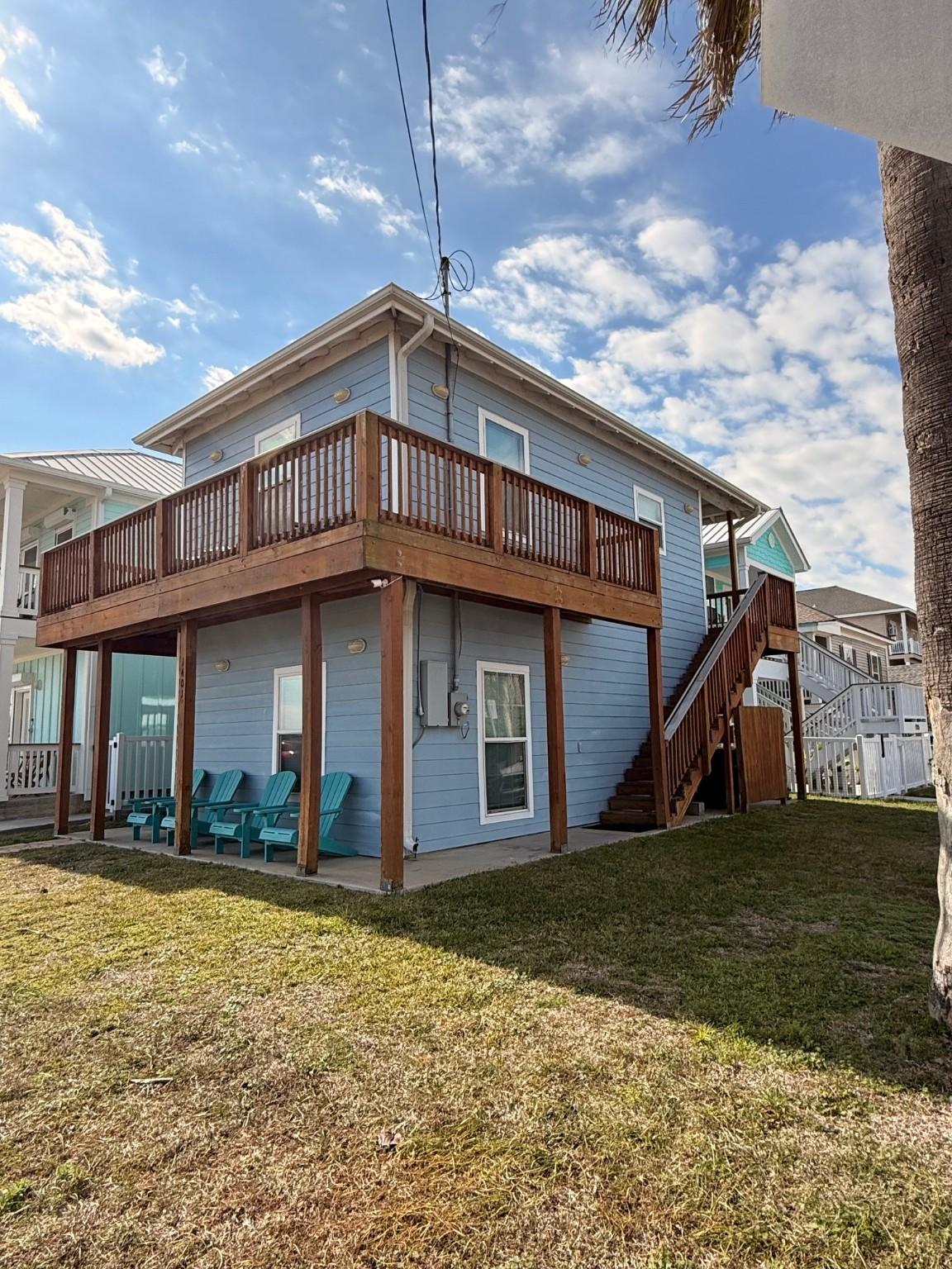 Image 4: This is a charming two-story coastal home with a s