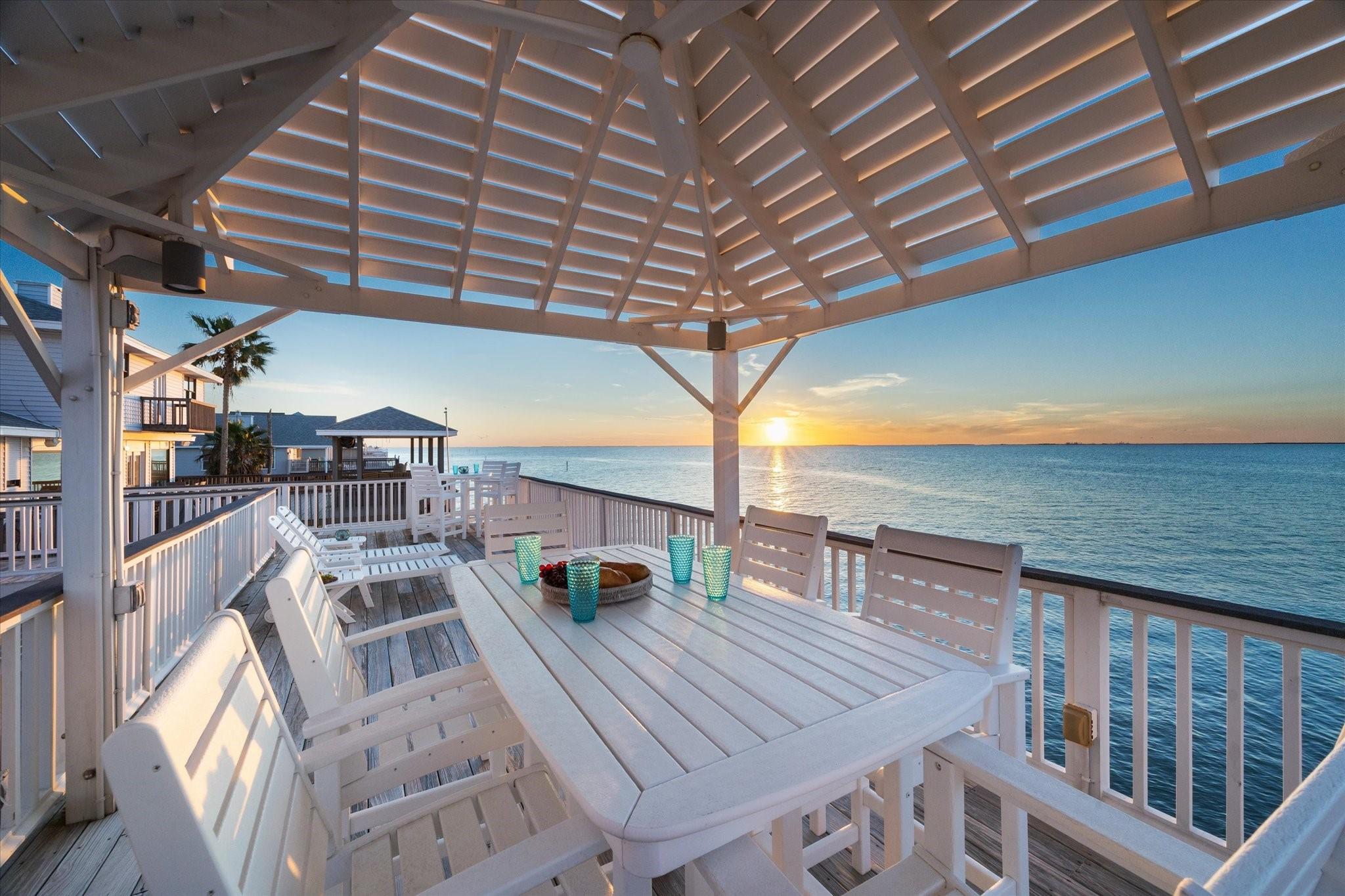 Image 2: Covered upper-level outdoor dining area overlookin