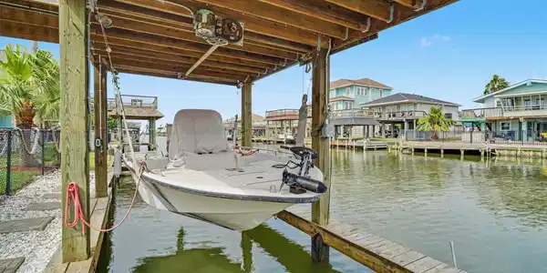 Image 2: The boathouse and boat lift makes living on the wa