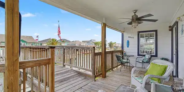 Image 3: Charming covered front porch offers a peaceful spo