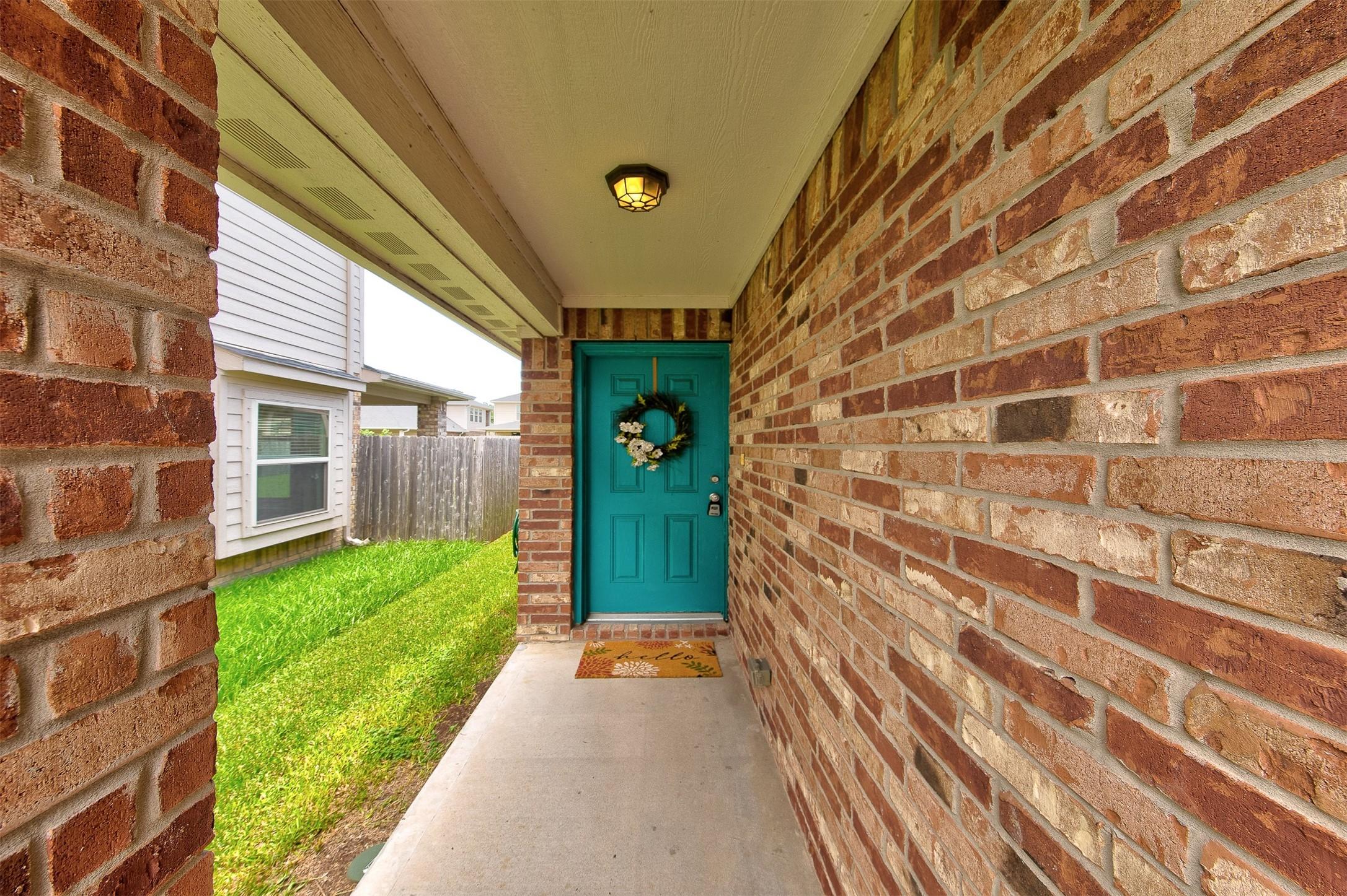 Image 2: Nice covered entry - let's go inside!