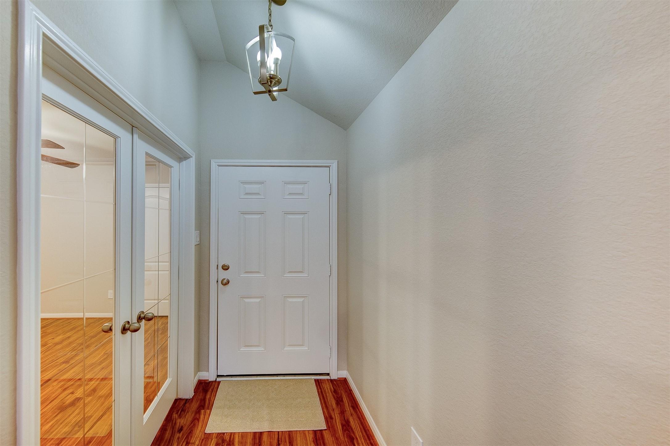 Image 3: LVP entry flows throughout the living areas & bedr