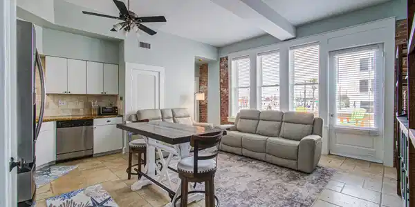 Image 3: Charming open-concept living area with abundant na