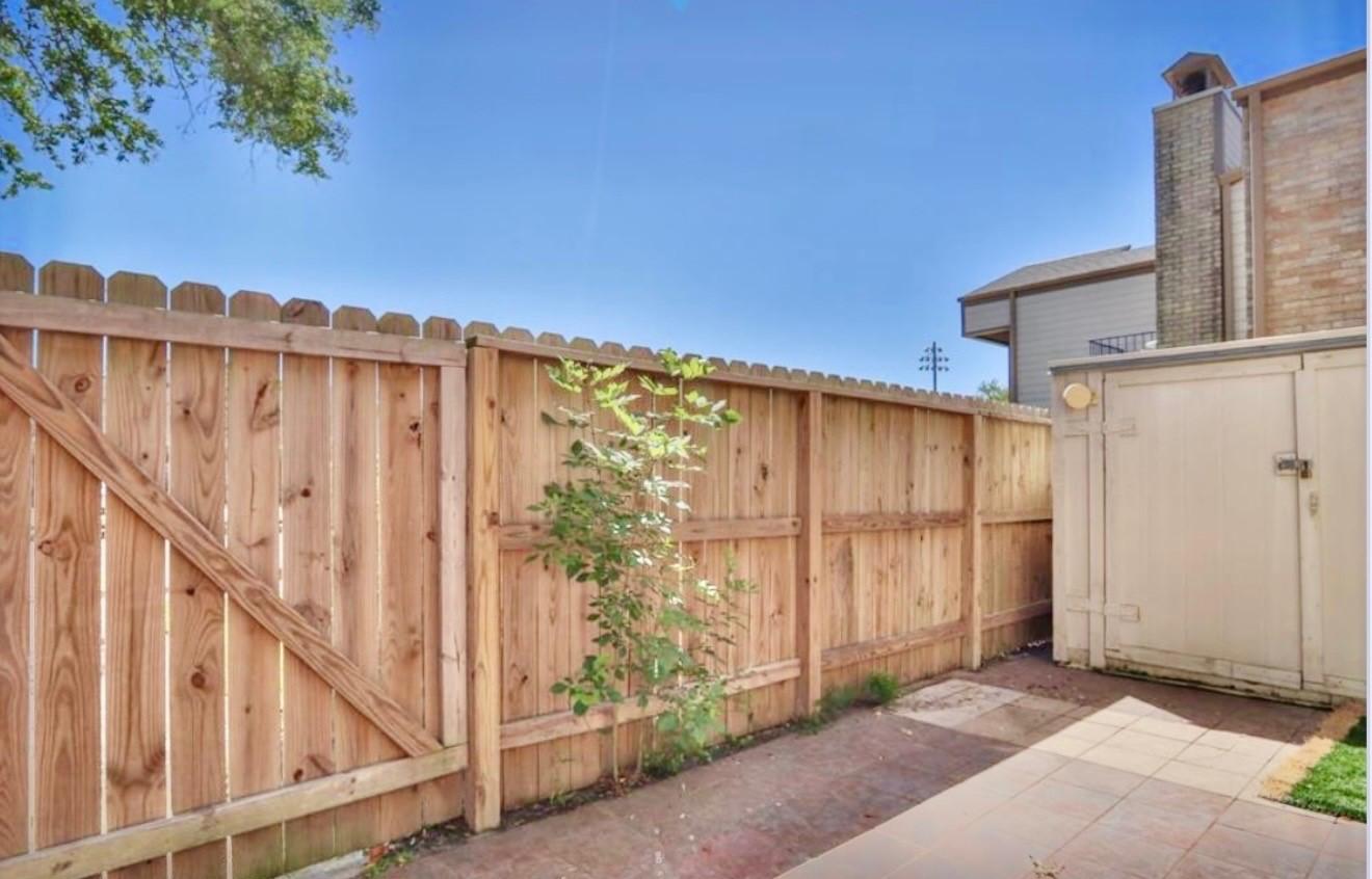 Image 4: Large storage unit and new fence is part of this u