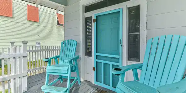 Image 4: The Cozy porch is perfect to enjoy your coffee and