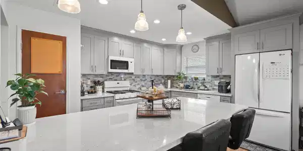 Image 4: Kitchen featuring a large island overlooking the d