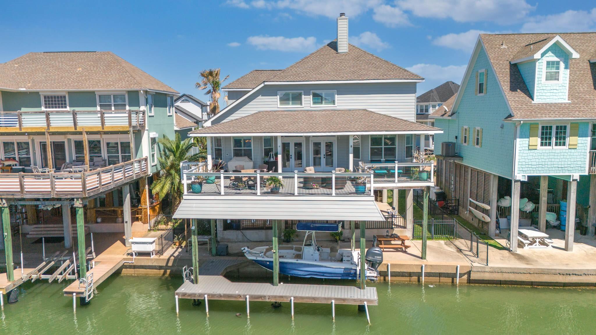 Image 3: Aerial view of back of home