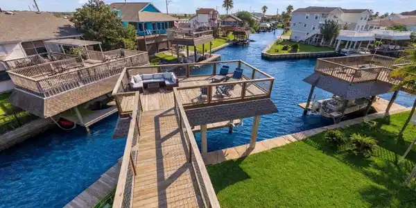 Image 2: Beautiful canal front home with expansive decks an