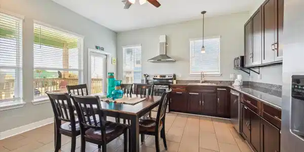 Image 4: Bright and inviting kitchen with modern appliances
