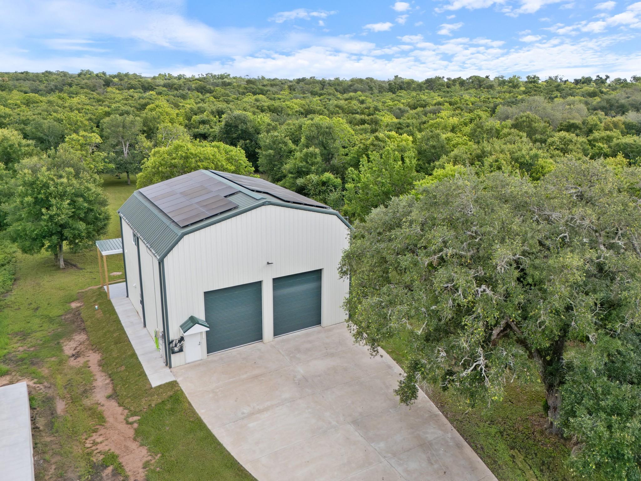 Image 1: Aerial view of the Barndominimum in Live Oak Bend