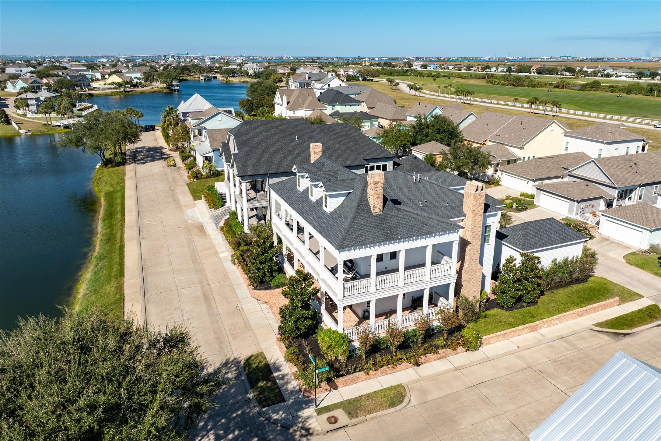 Image 3: Surrounded by custom estates, this lakefront beaut