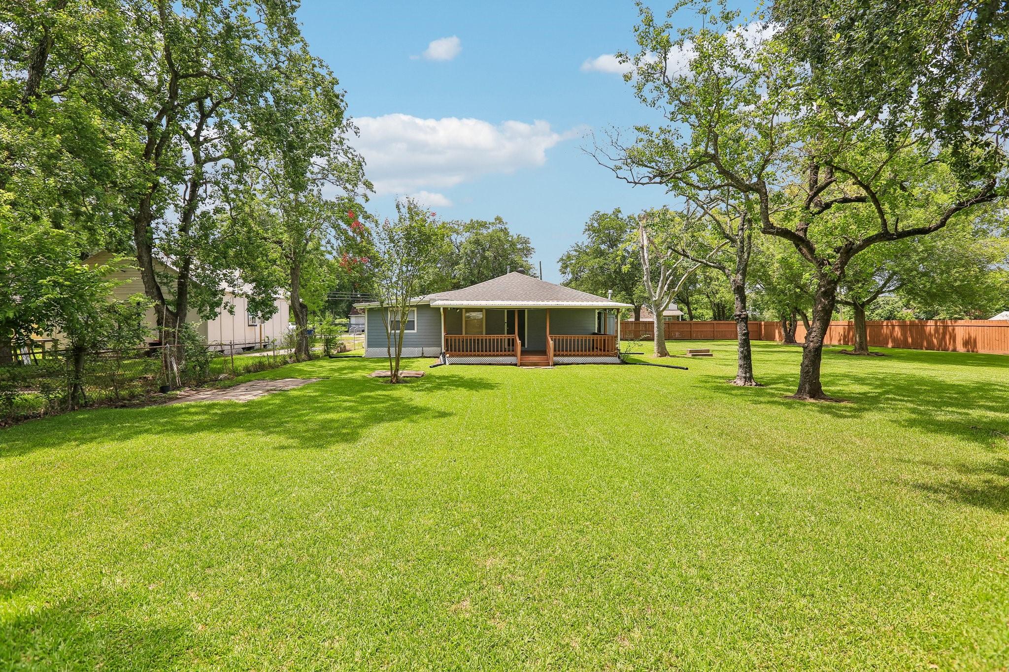 Image 4: Ground level view of back of home
