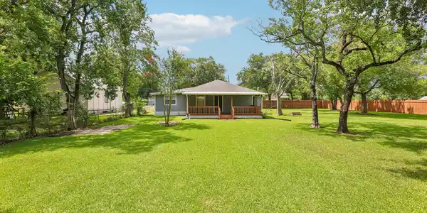 Image 4: Ground level view of back of home