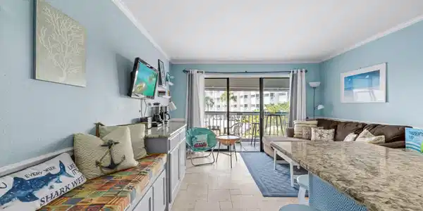 Image 4: Bright, open living area with coastal-inspired d&eacute;c