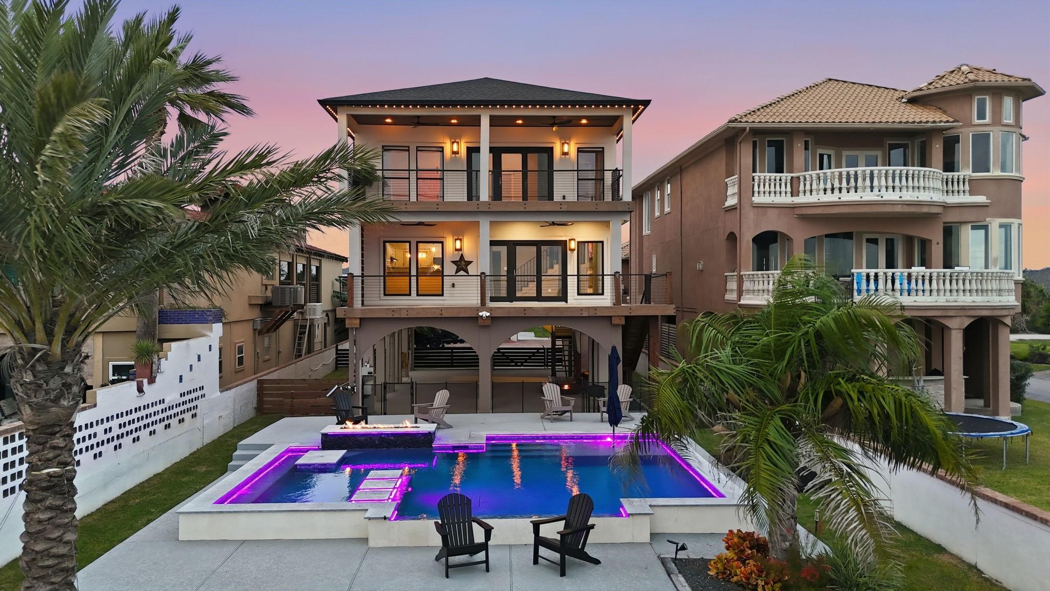 Image 1: Sunset frames this luxurious bayfront retreat, sho