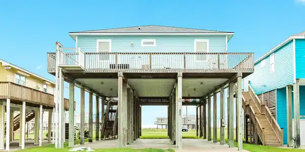Image 4: Nice long driveway, with covered parking under hom