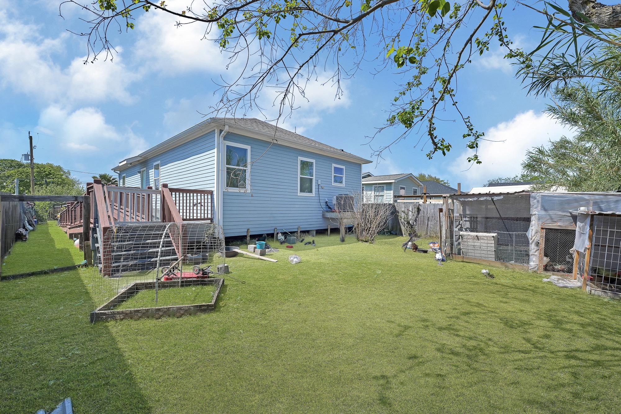 Image 2: Spacious backyard currently being used to raise ch