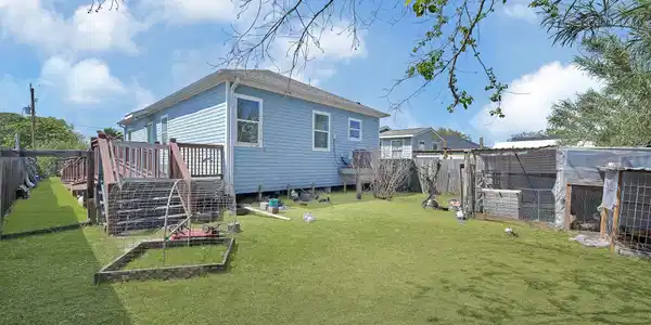 Image 2: Spacious backyard currently being used to raise ch