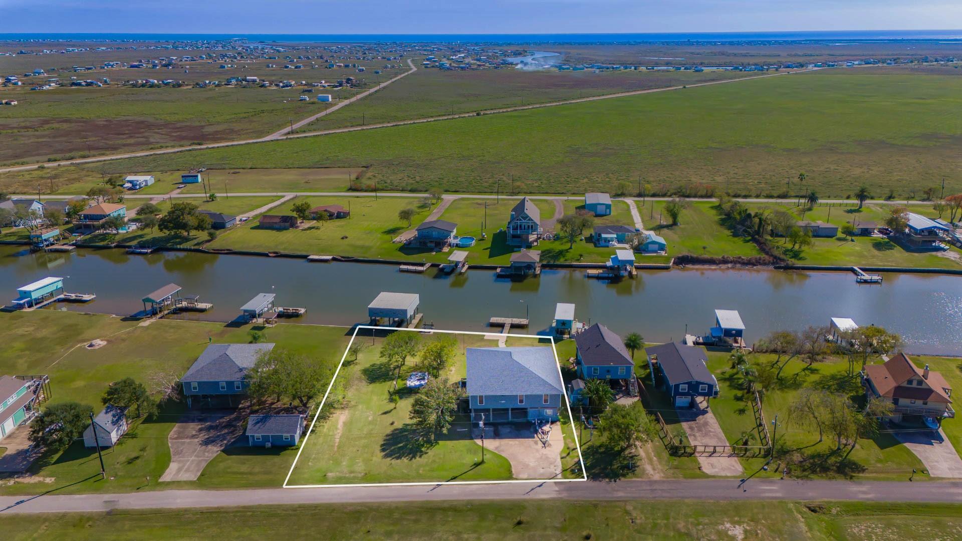 Image 4: This aerial view highlights the home&rsquo;s prime water