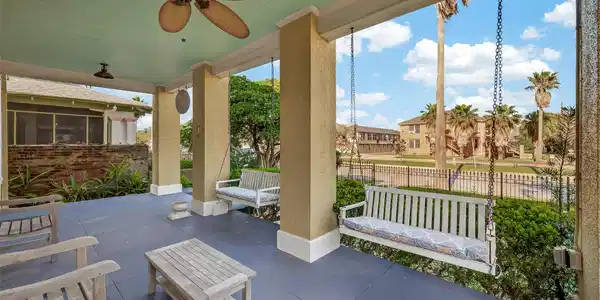 Image 4: Relax on the porch with serene views of the beauti