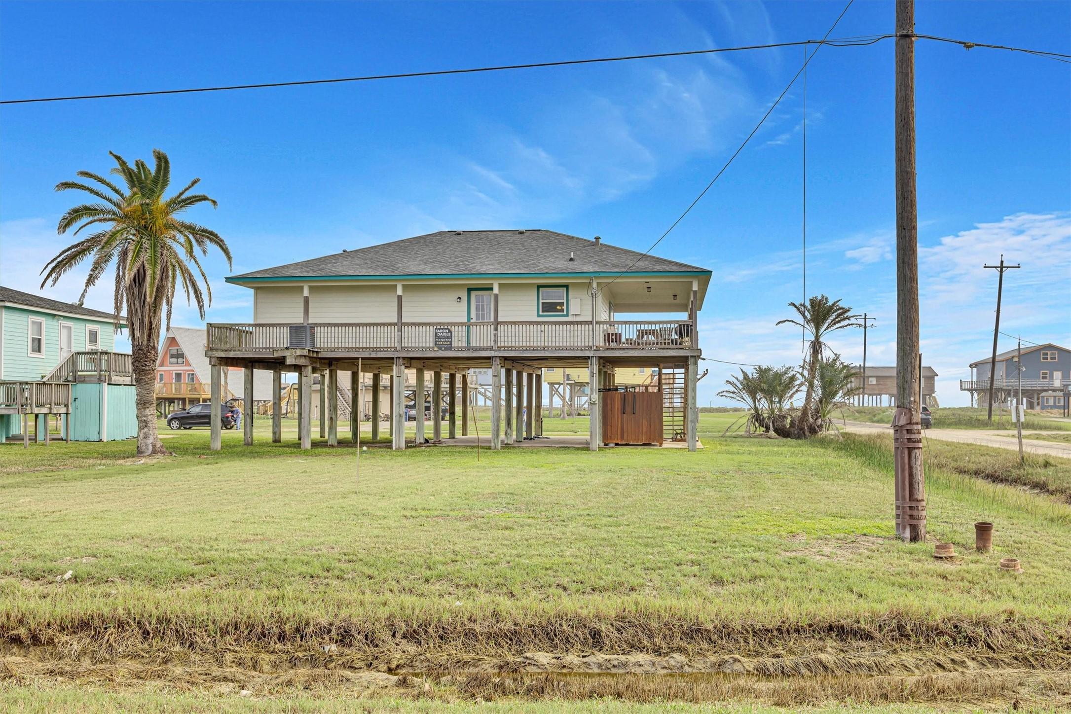 Image 2: This view of the rear of the house is from Surf St