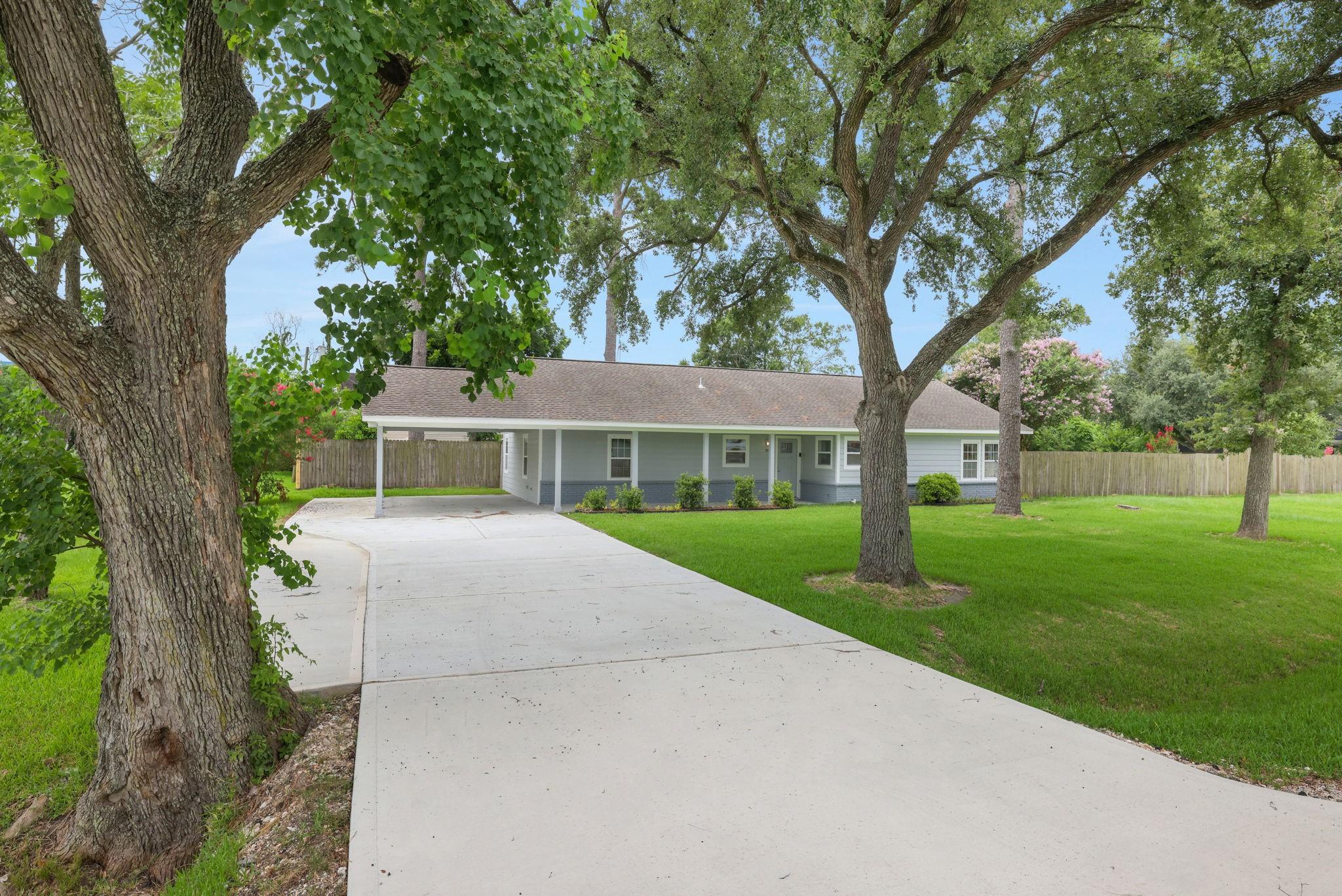 Image 1: Charming single-story home with a welcoming front