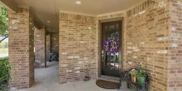 Image 2: Front porch with a sitting area
