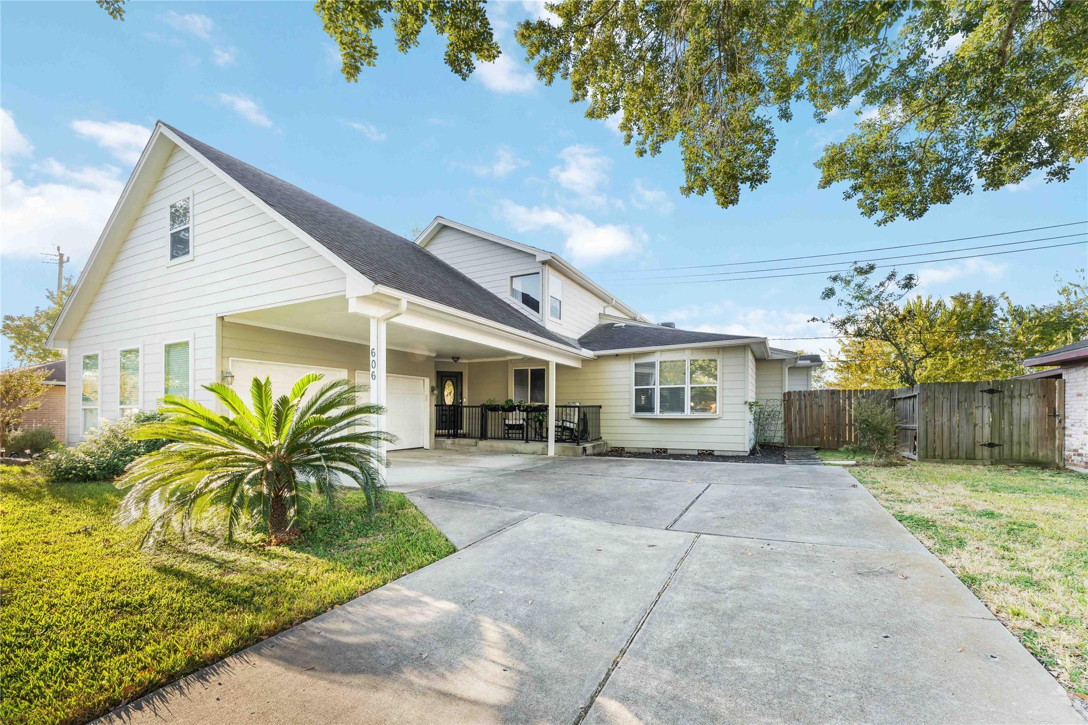 Image 3: This charming two-story home features a modern ext