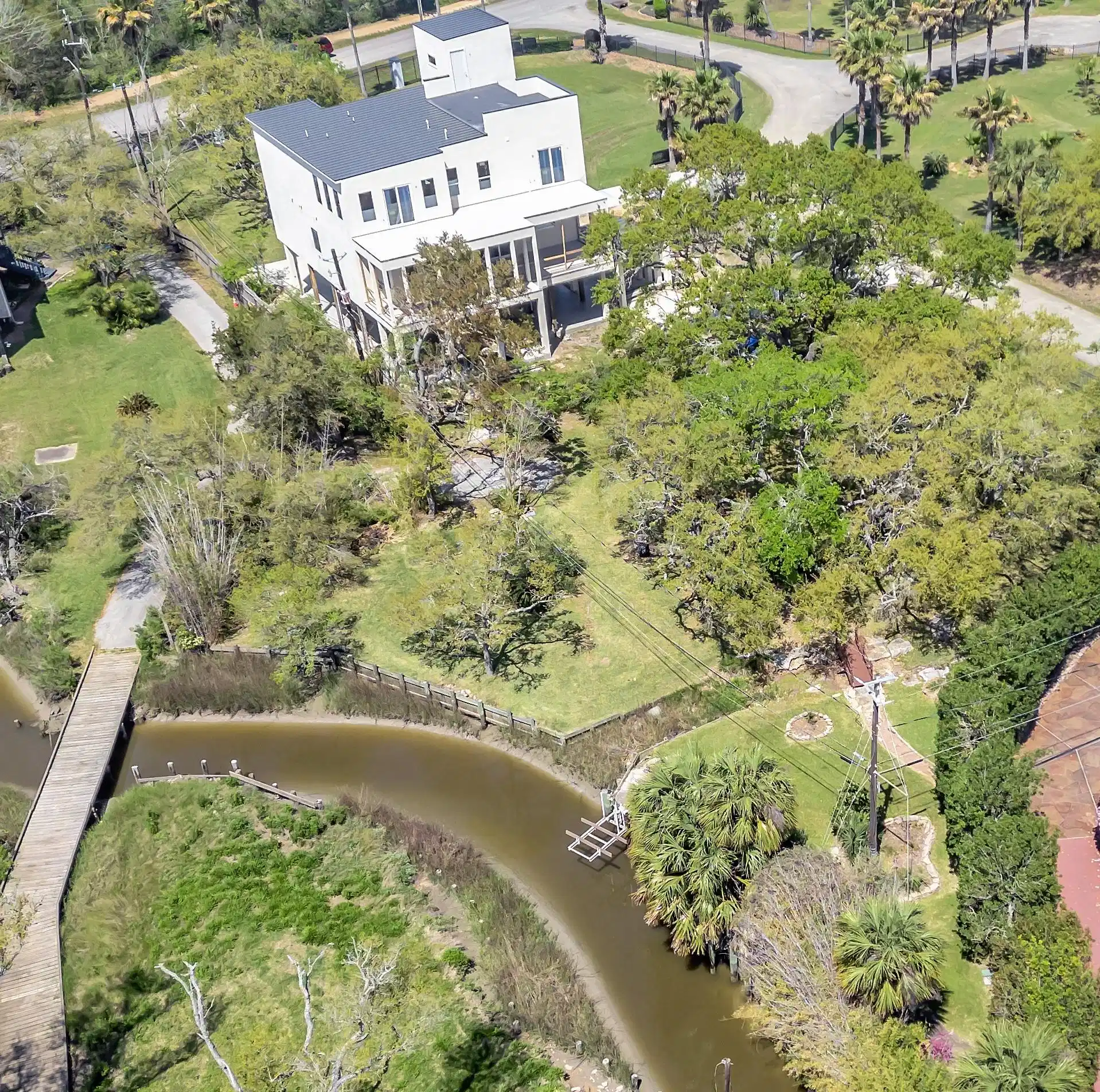 Image 1: Aerial view showcasing the property's mature lands