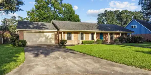 Image 4: 2 car garage with a long driveway.