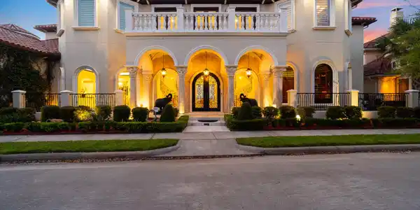 Image 2: This Mediterranean style home sits on nearly half