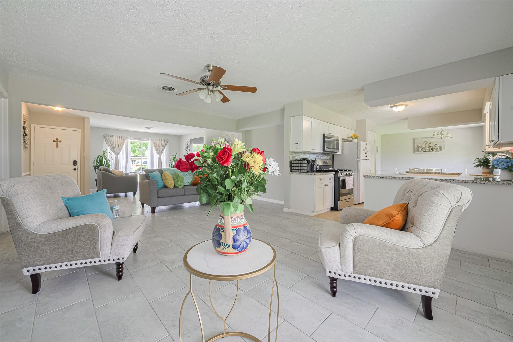 Image 1: A seamlessly designed open-concept layout effortle