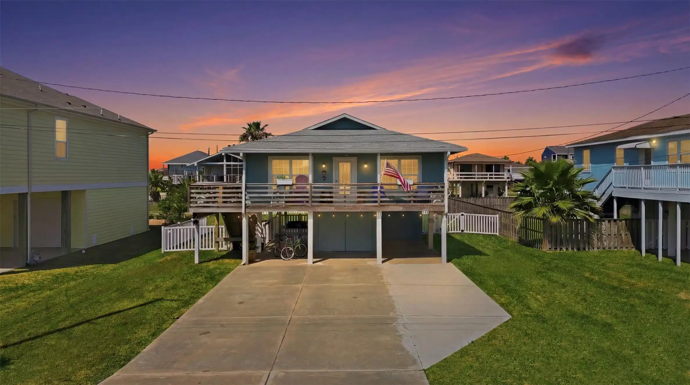 Image 1: Picture-perfect coastal exterior with a spacious b