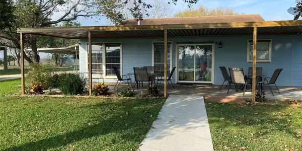 Image 2: Back Patio With Relaxing Porch, overlooking the hu