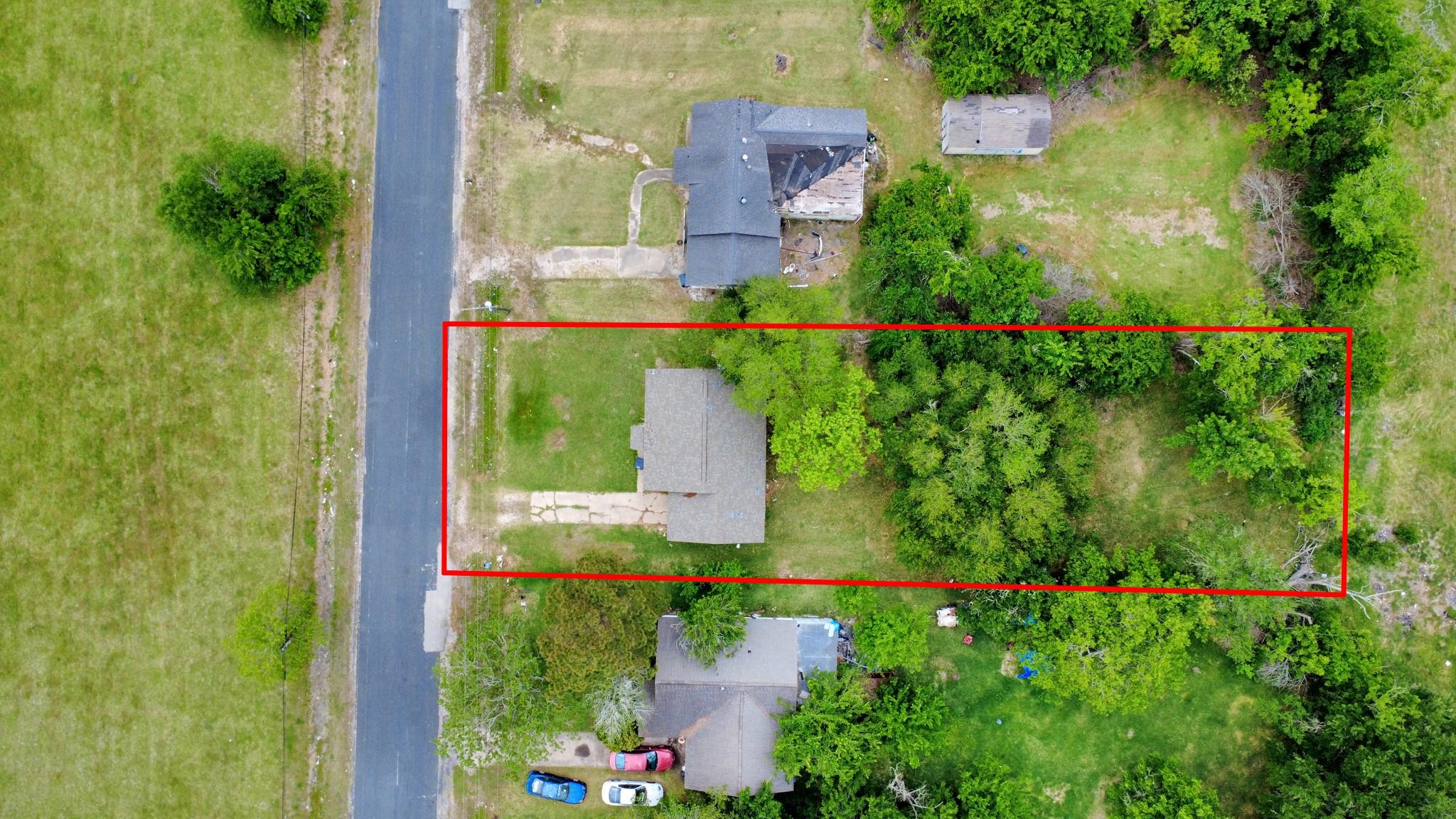 Image 2: Aerial view of the property, notice home sits on a