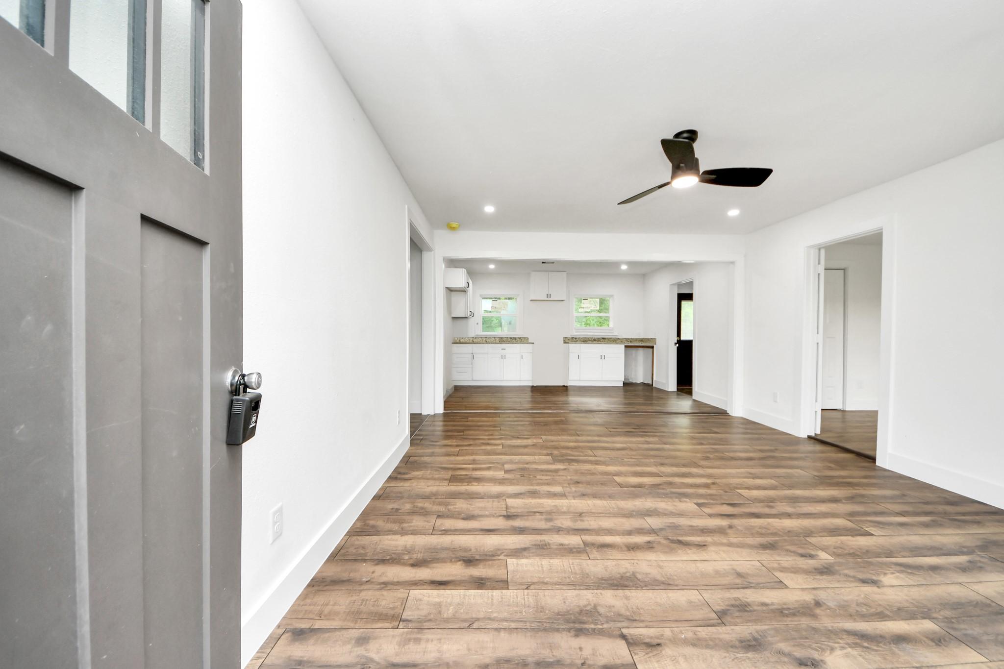 Image 3: This photo shows a modern, open-concept living are
