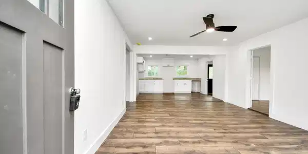 Image 3: This photo shows a modern, open-concept living are