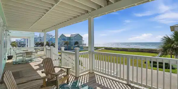 Image 2: This charming beachfront property welcomes you wit