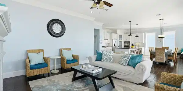 Image 4: This cozy living room features a welcoming firepla