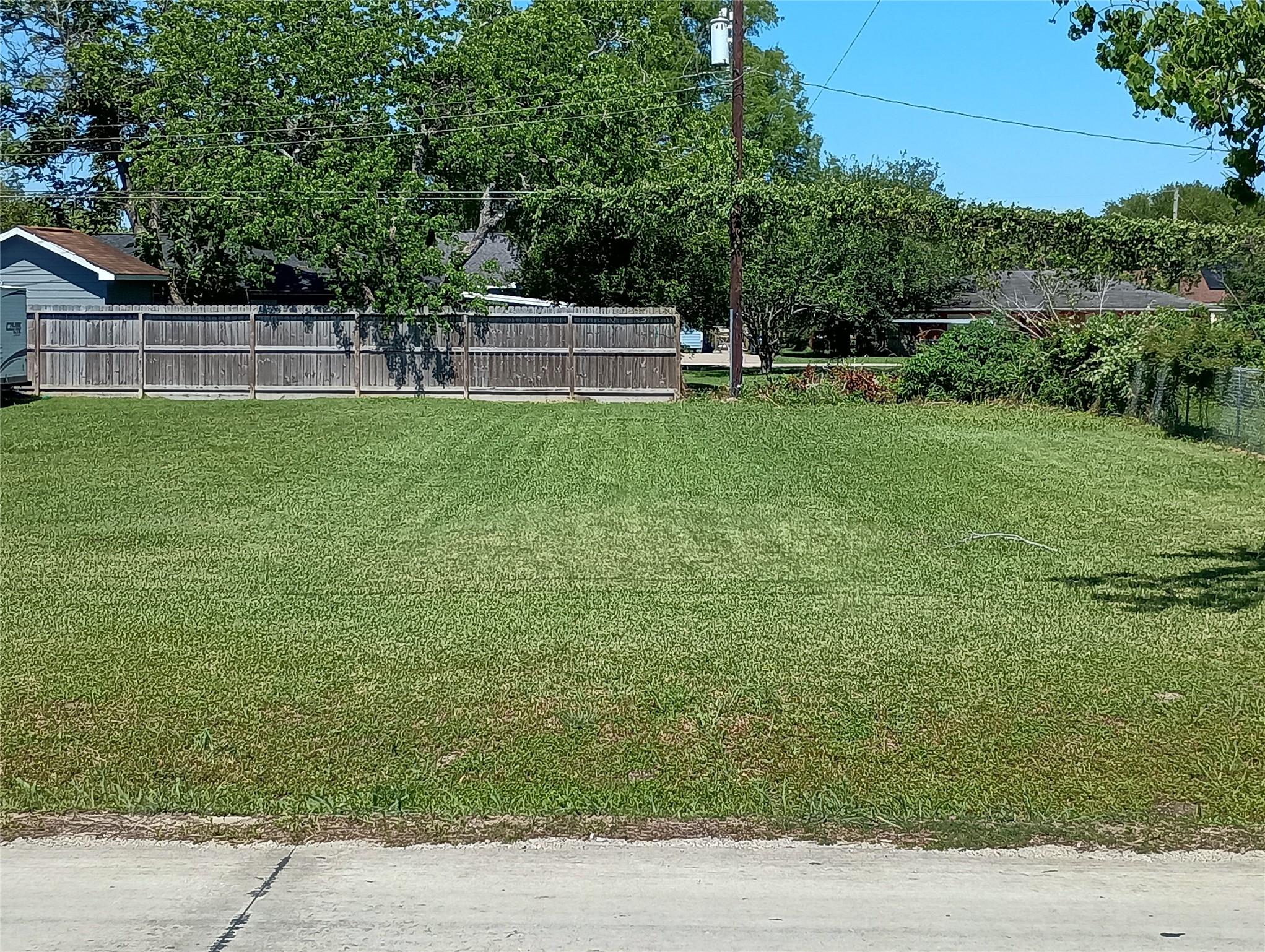 Image 1: The front of the lot facing to the back showing a