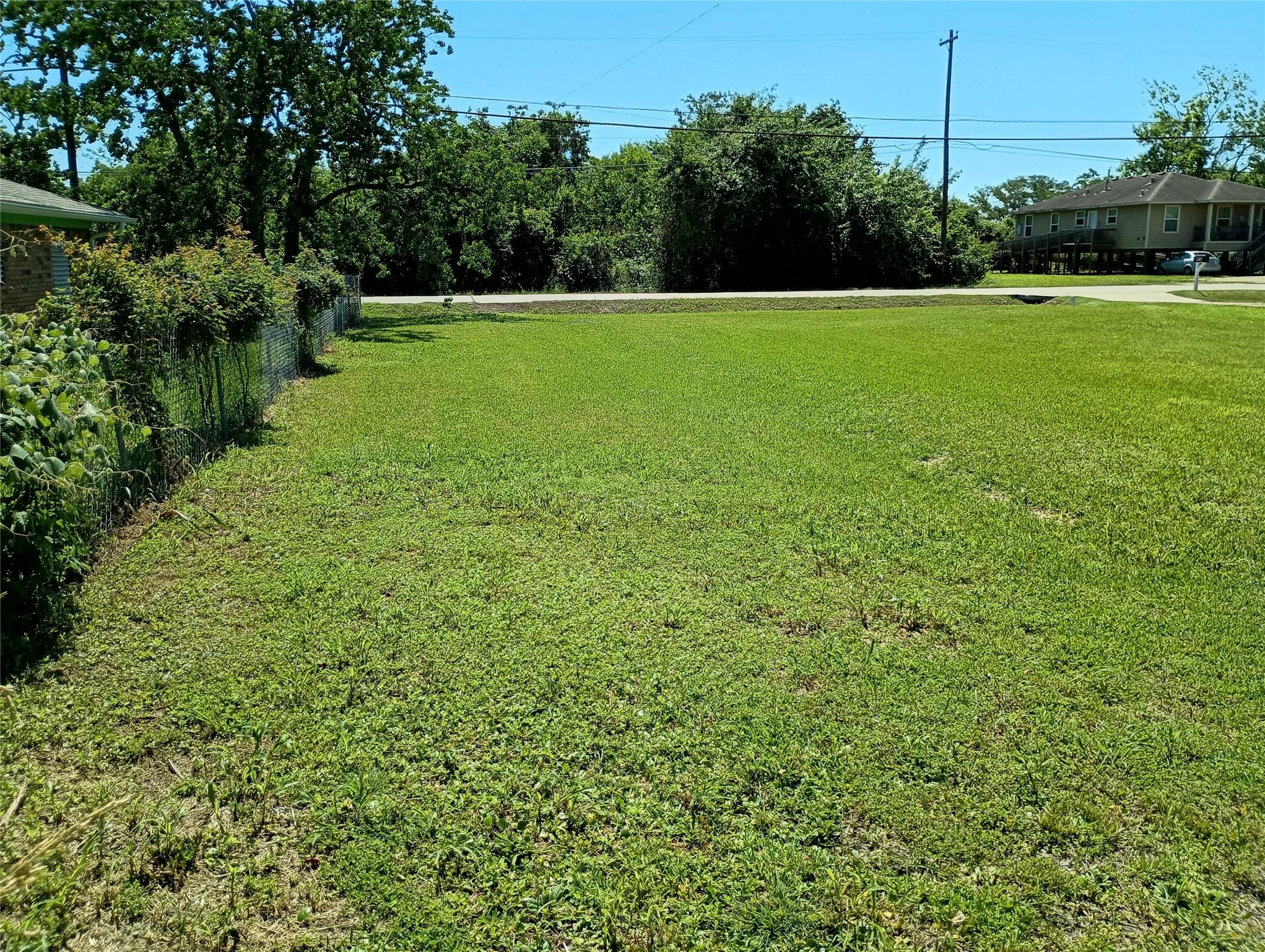 Image 3: The left side back corner of the lot facing Fairwo