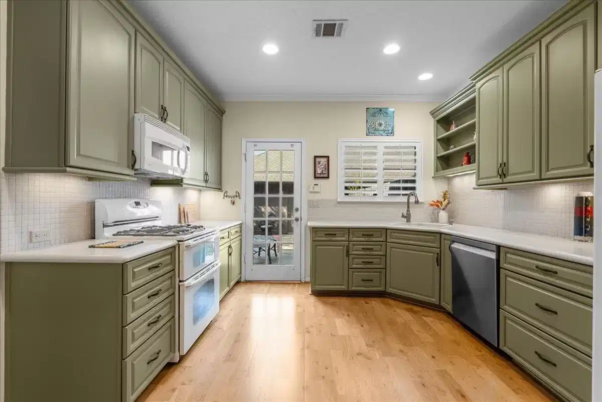 Image 1: Well-appointed kitchen featuring abundant cabinetr