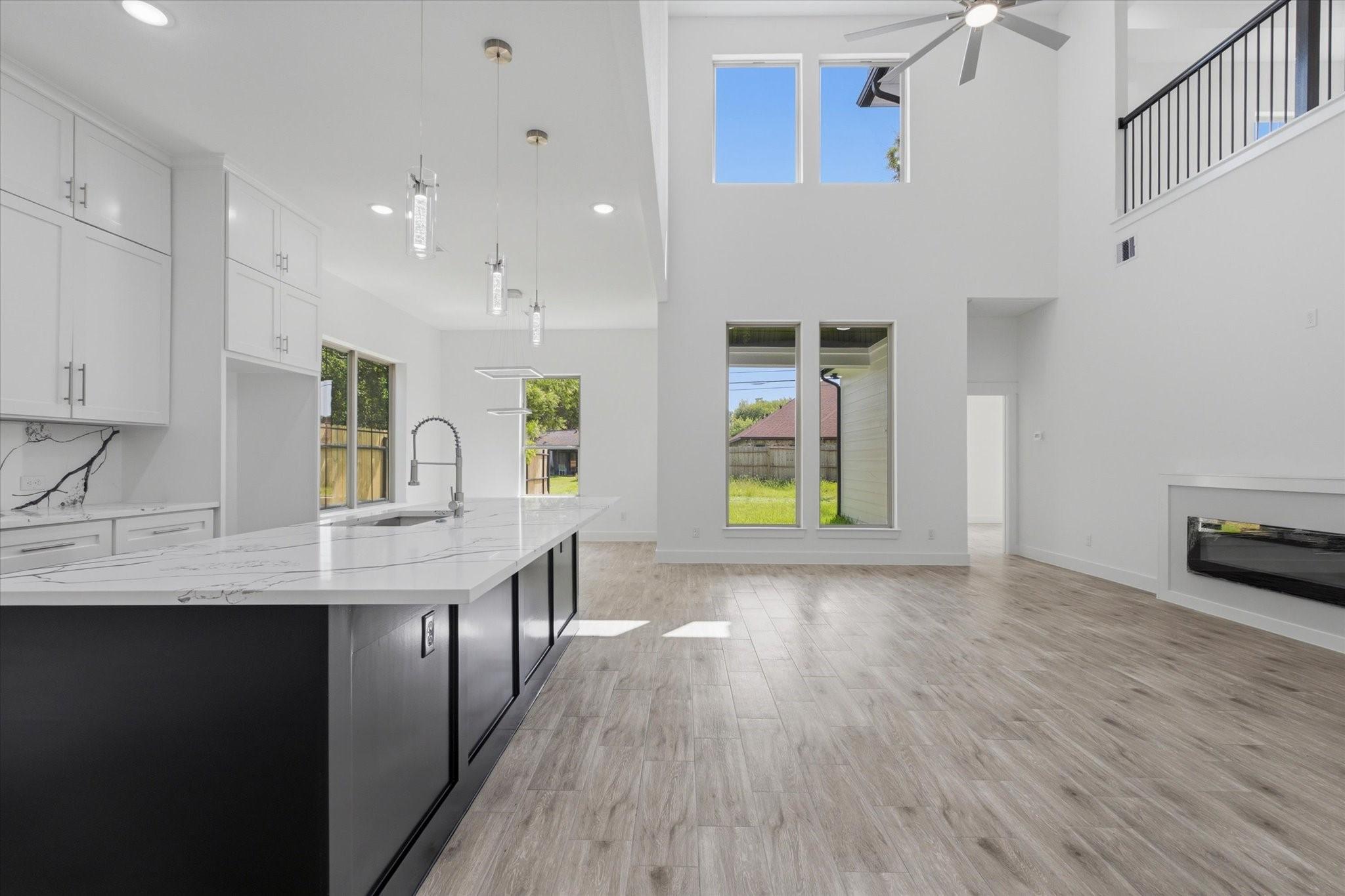 Image 1: Welcome to 707 S Iowa St, where soaring 21-foot ce