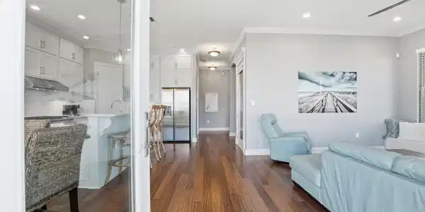 Image 3: Designed for gathering, this open-concept living s