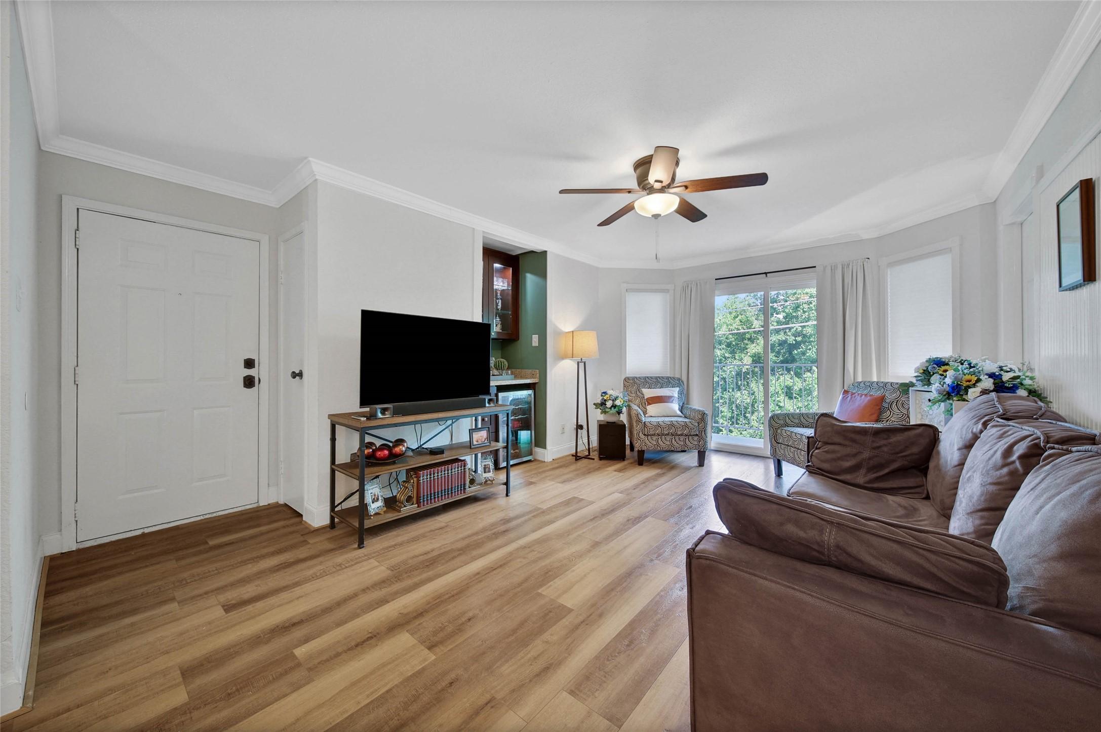 Image 2: Beautiful open living with a dry bar