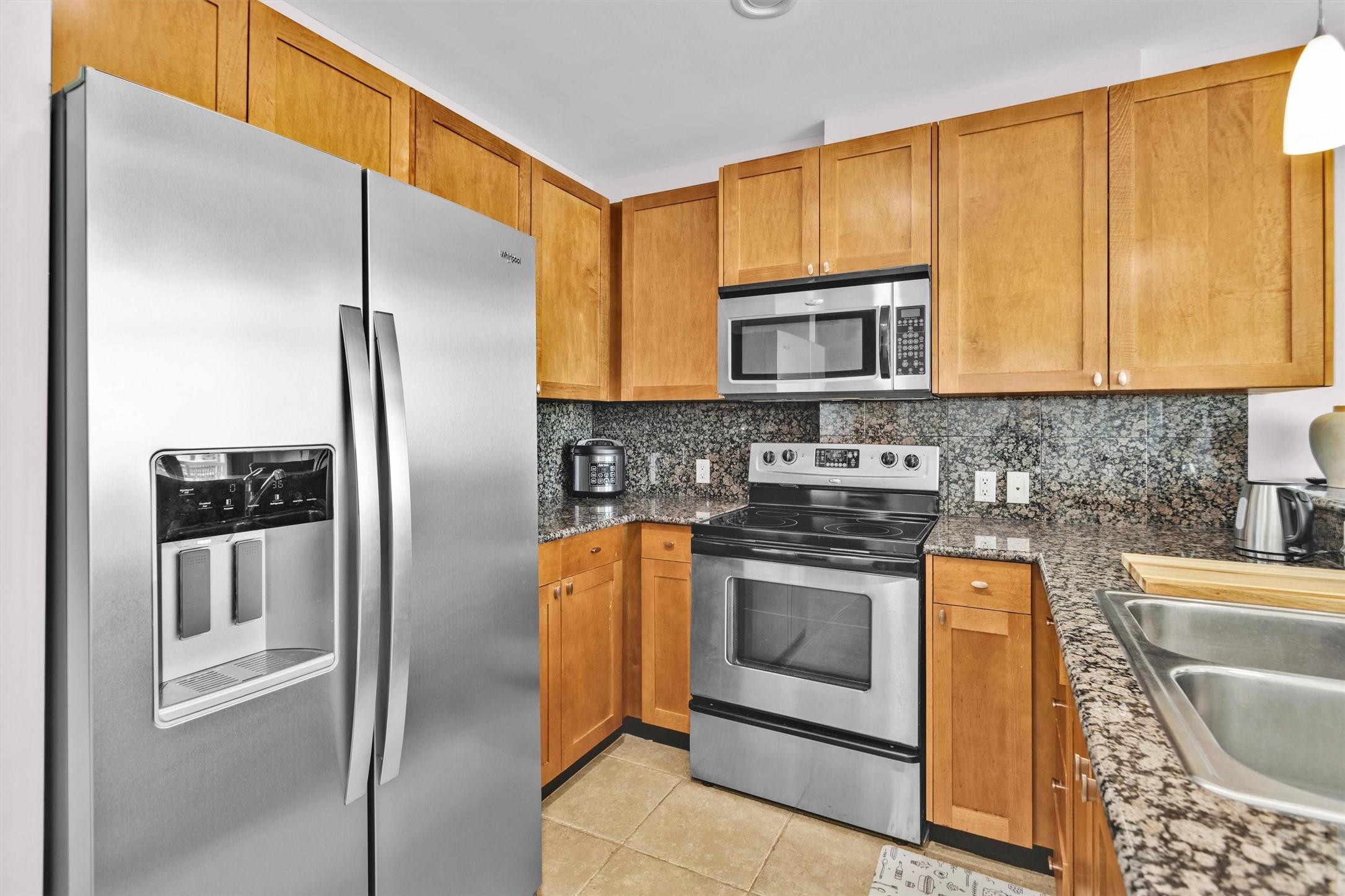 Image 4: Alternate view of kitchen with ample cabinet space
