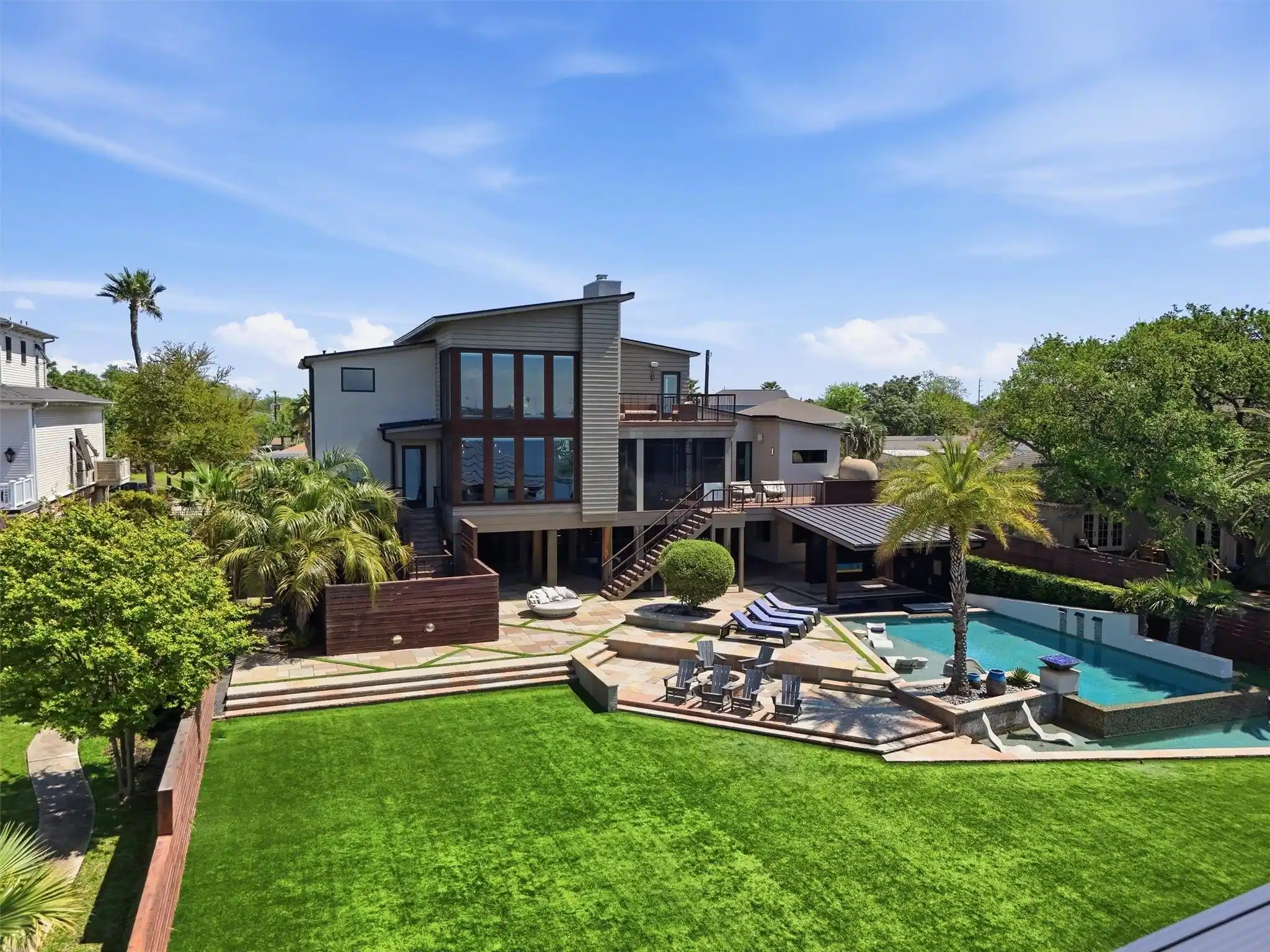 Image 1: A true backyard oasis designed for resort-style li