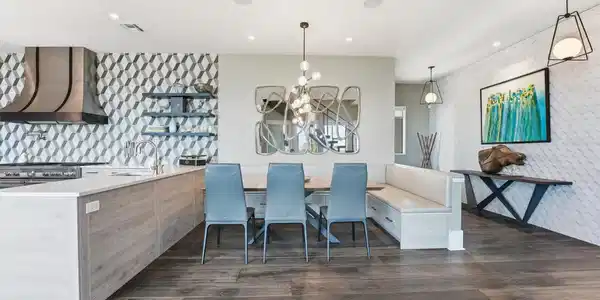 Image 4: Elegant dining area featuring a custom built-in be
