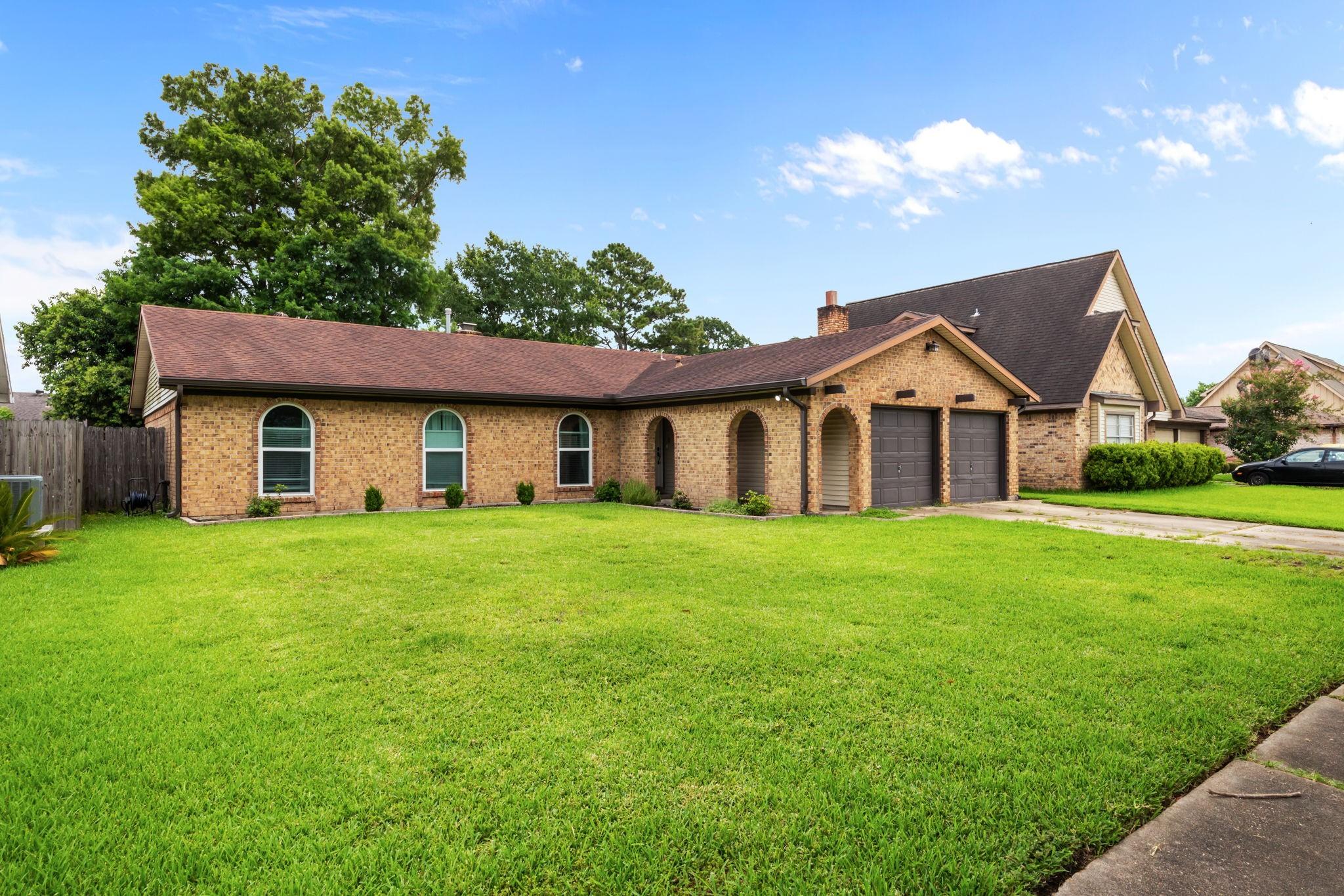 Image 2: This charming 3-bedroom, 2-bath ranch home feature